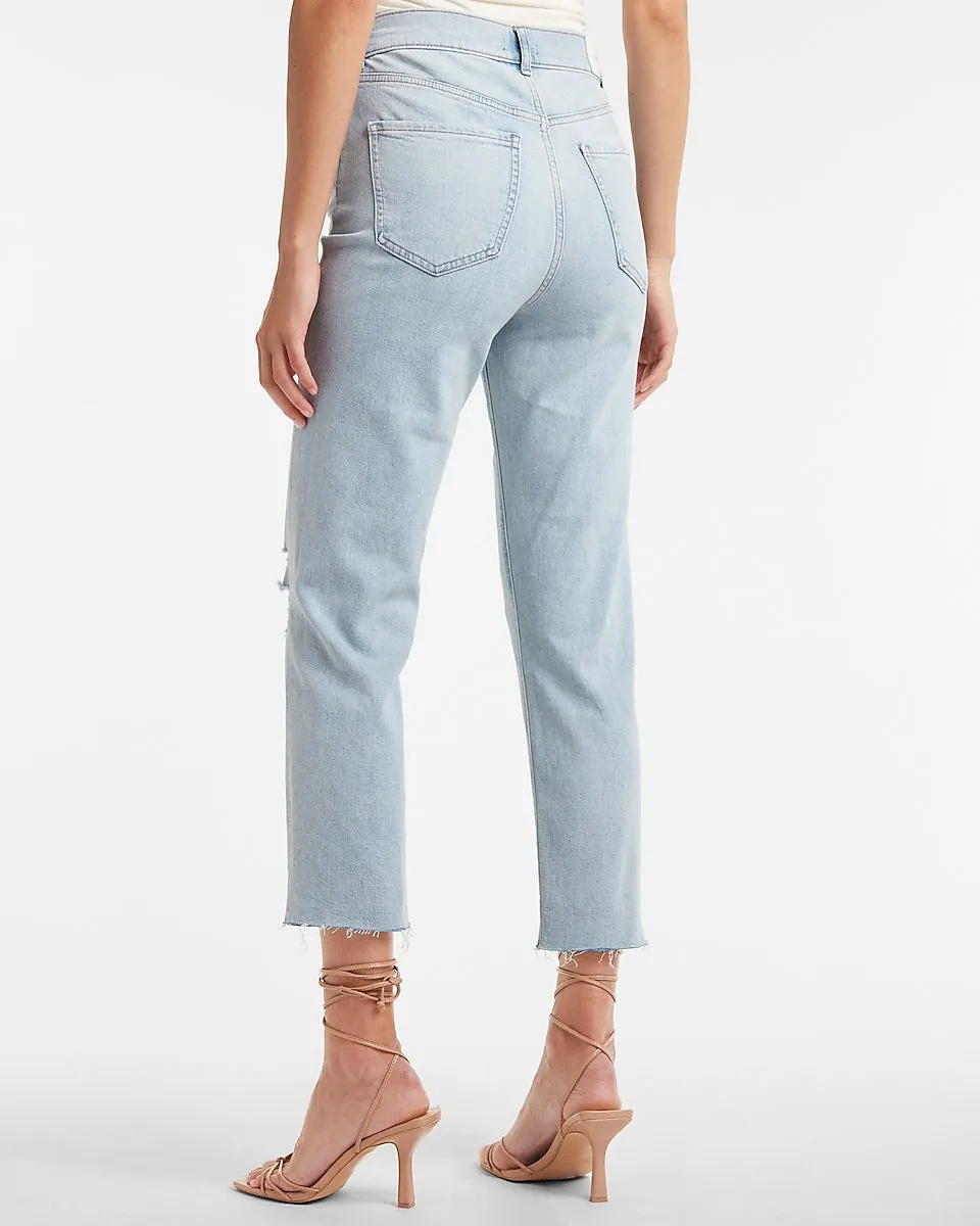 Super High Waisted Ripped Raw Hem Mom Jeans in Light Wash